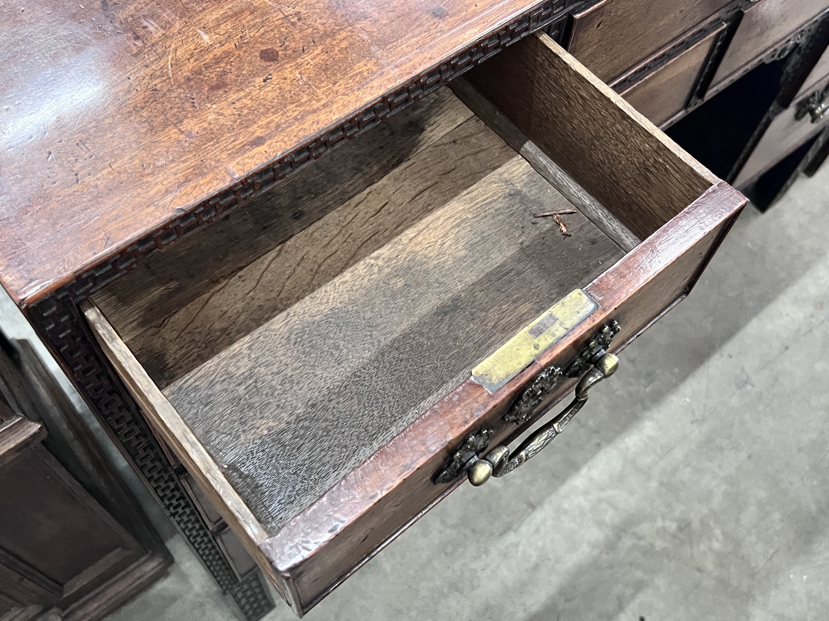 A George III Chippendale style mahogany blind fret kneehole desk, width 112cm, depth 48cm, height 87cm.